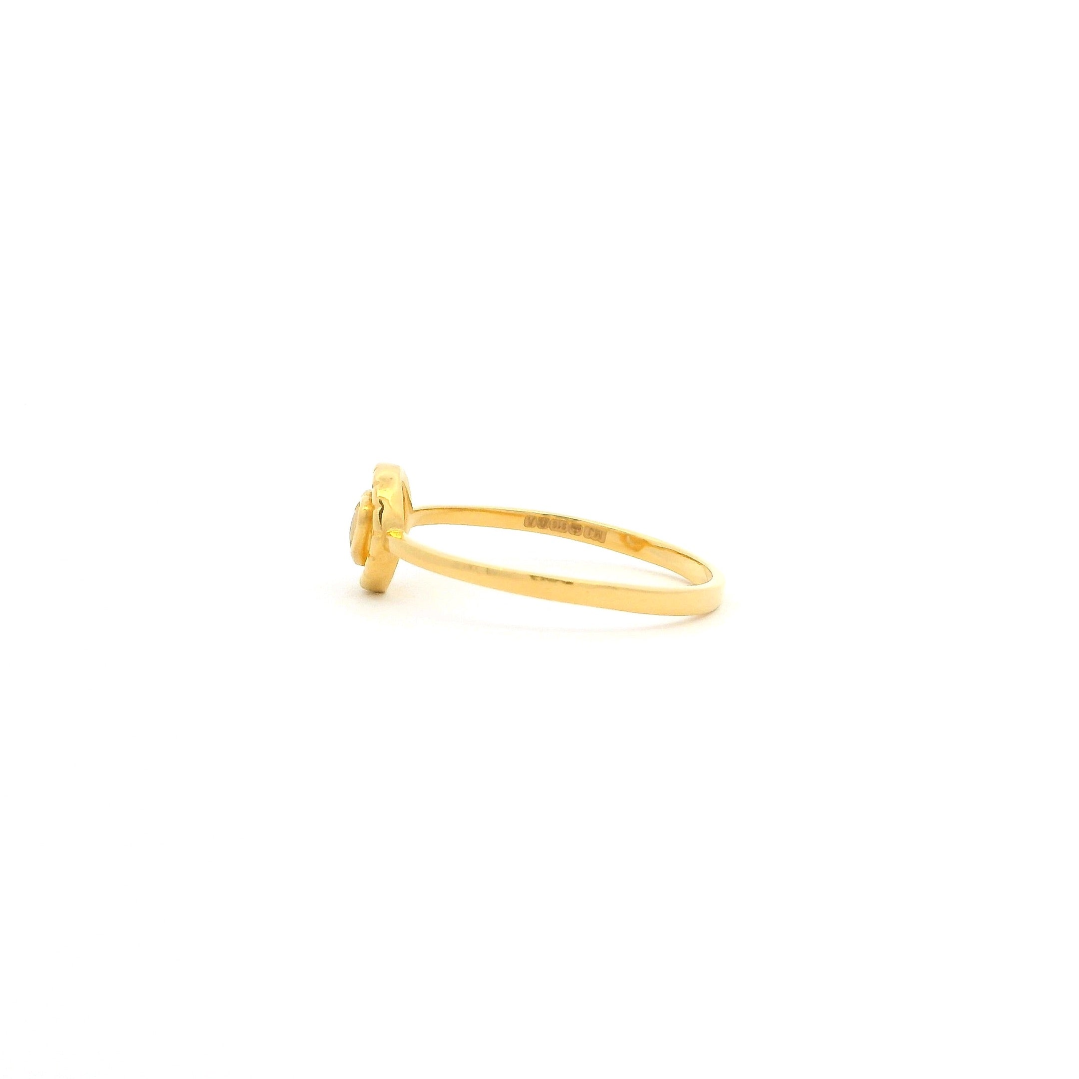 Gold ring on a white background