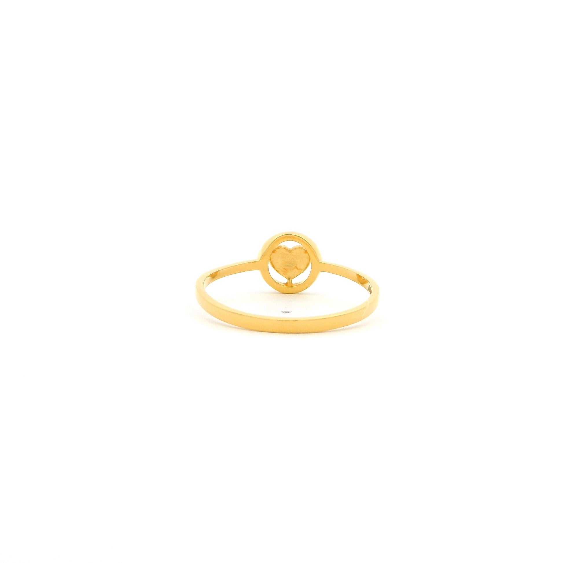 Gold ring with a circular design on a white background
