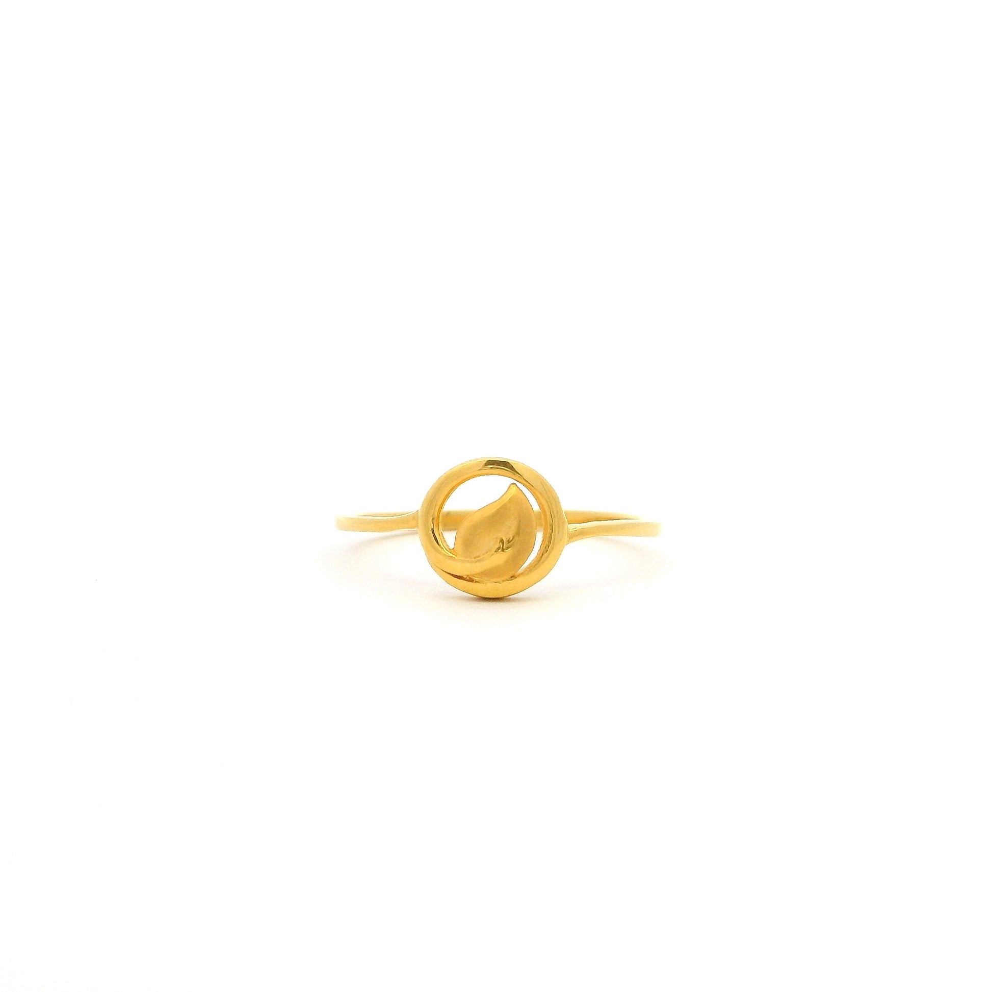 Gold ring with a unique design on a white background