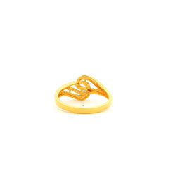 Gold ring with a heart design on a white background