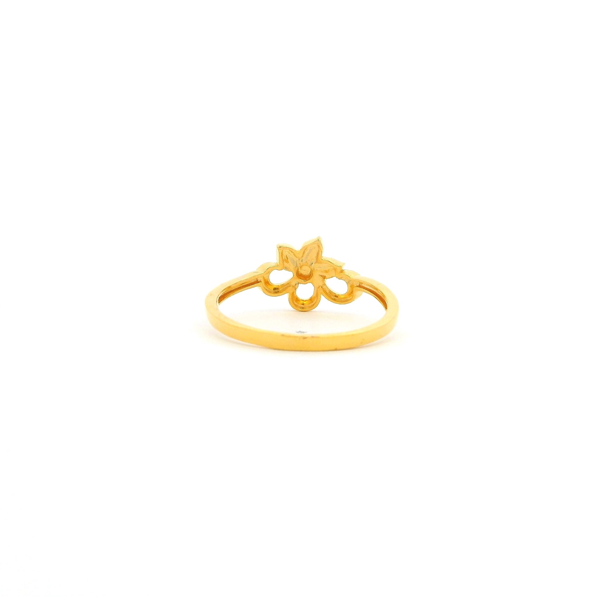 Gold ring with a decorative design on a white background