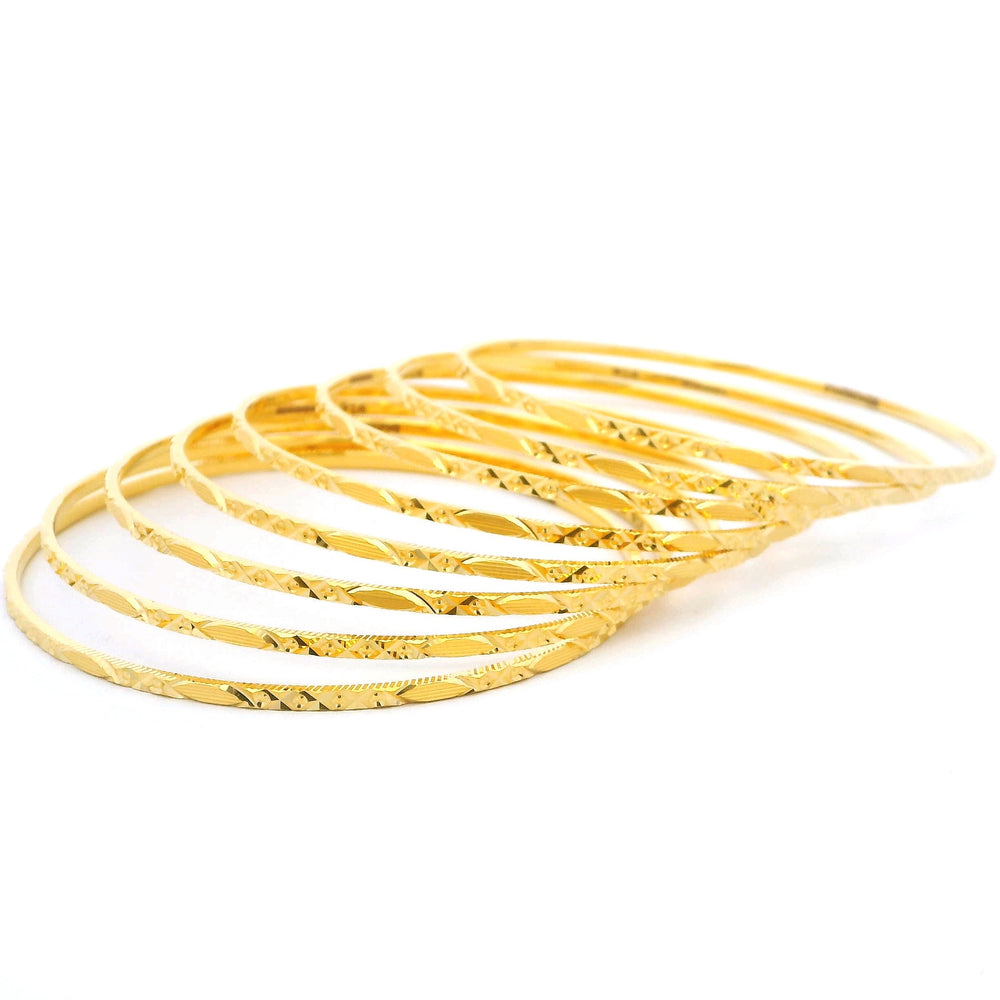Traditional Set of Eight 22ct Gold Bangles with Elegant Detailing