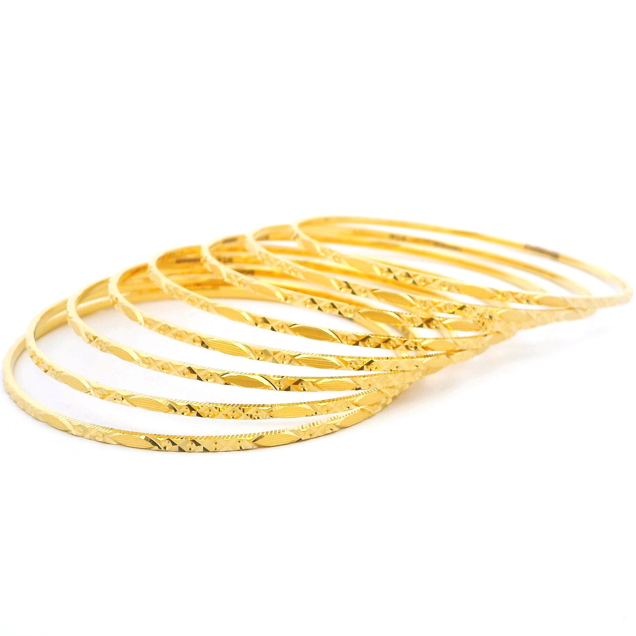 Traditional Set of Eight 22ct Gold Bangles with Elegant Detailing