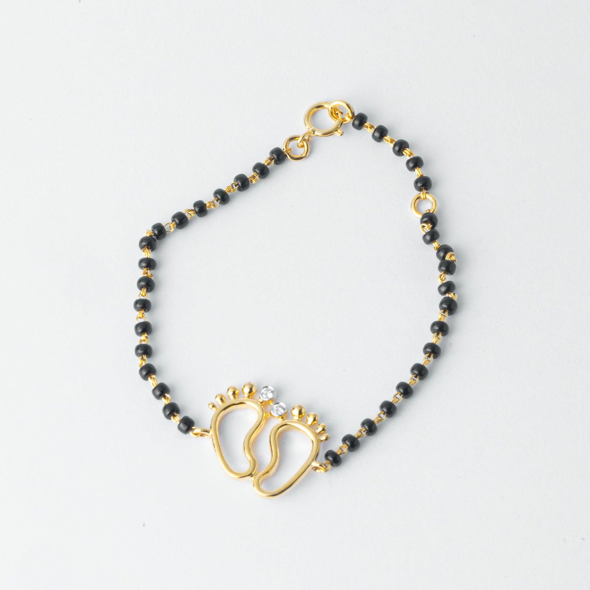 18ct Yellow Gold / 18ct White Gold Diamond Adjustable Children's Bracelet with Small Feet and Black Beads MCS4275 - Minar Jewellers